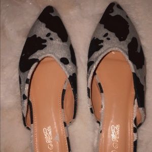 Cow print flats.